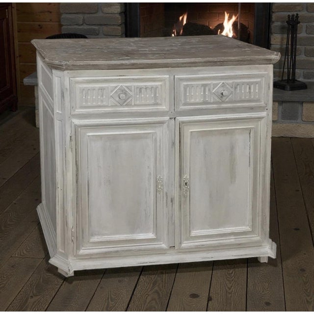 Elegant in its restraint and beautifully balanced in proportion, this 18th century Country French Louis XVI painted buffet...