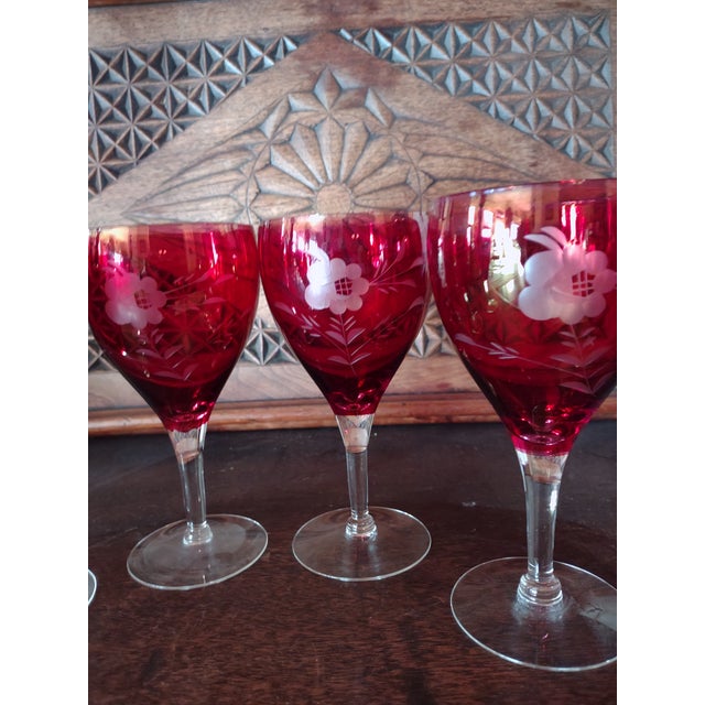 Offered is a set of 6 beautiful etched cranberry stems from the 1920's. They stand 6.5" tall and are 3.25" across the top....