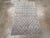 A vintage Turkish Anatolian throw rug. A slightly curvy field tone lattice closely frames an offset, half-drop array of...
