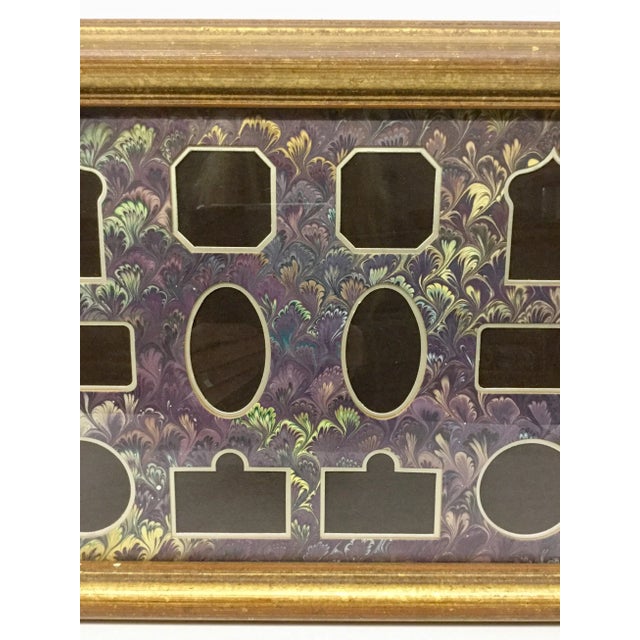 A gorgeous and unique way to show off your small photos. This work of art has been waiting for 30 years to hold 12 photos...