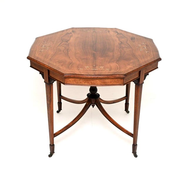 A beautiful, elegant and extremely well made antique Edwardian inlaid centre table. This was made in England, it dates...