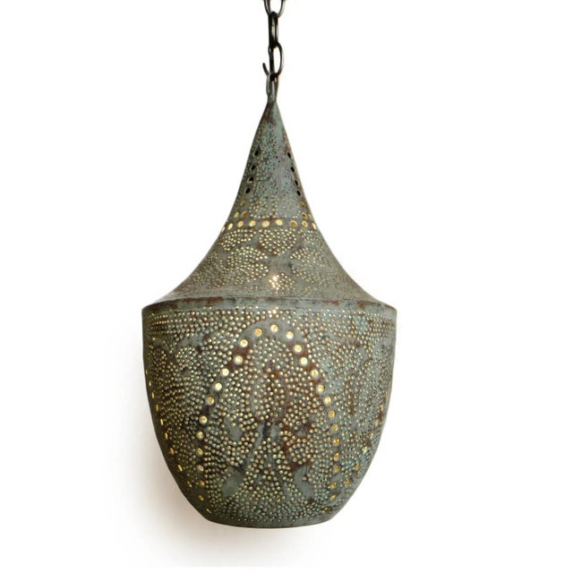 Beautiful verdigris handmade copper lantern with perforated decorative design that emanates intricate light patterns. Open...