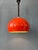 Beautiful red vintage pendant lamp made out of metal. It has rounded, slightly oval shape. It can easily be pulled up and...