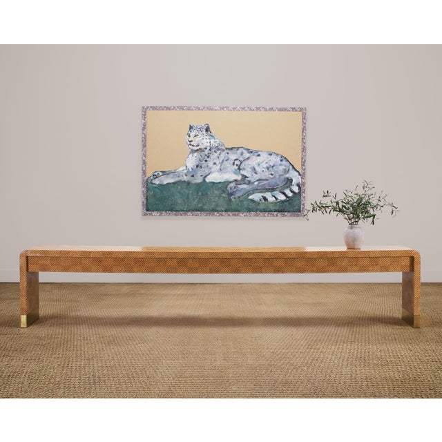 A monumental mid-century waterfall console constructed out of a woven grasscloth embellished frame measuring more than...