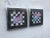 Two art pieces of Memphis style, depicting a series of colorful geometic figures randomly placed over a back and white...