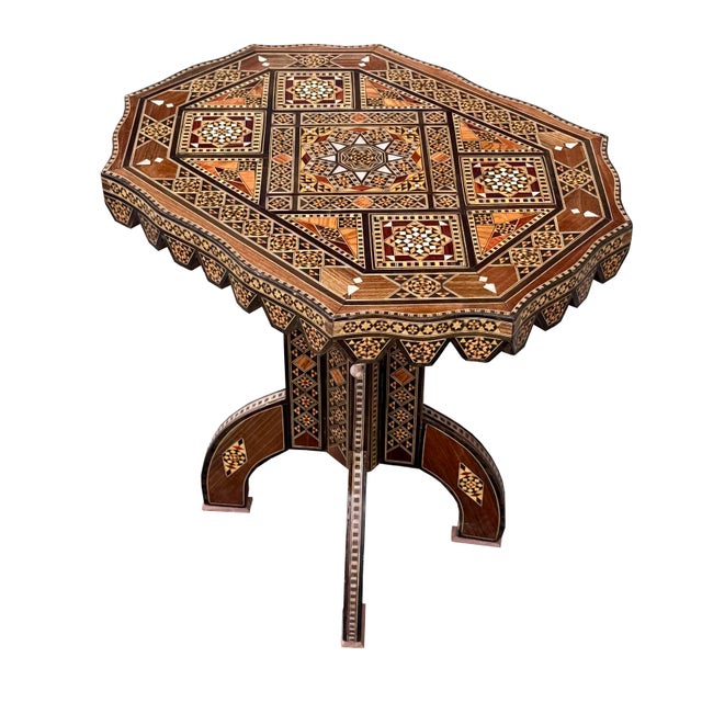 An elegant side table, showcasing an exceptionally intricate geometric inlay. Expertly handcrafted from a refined mix of...