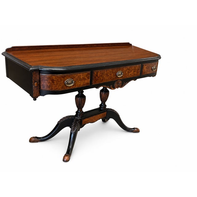 A striking restored writing desk by Berkey & Gay Furniture Co., featuring richly figured wood, elegant carved details, and...