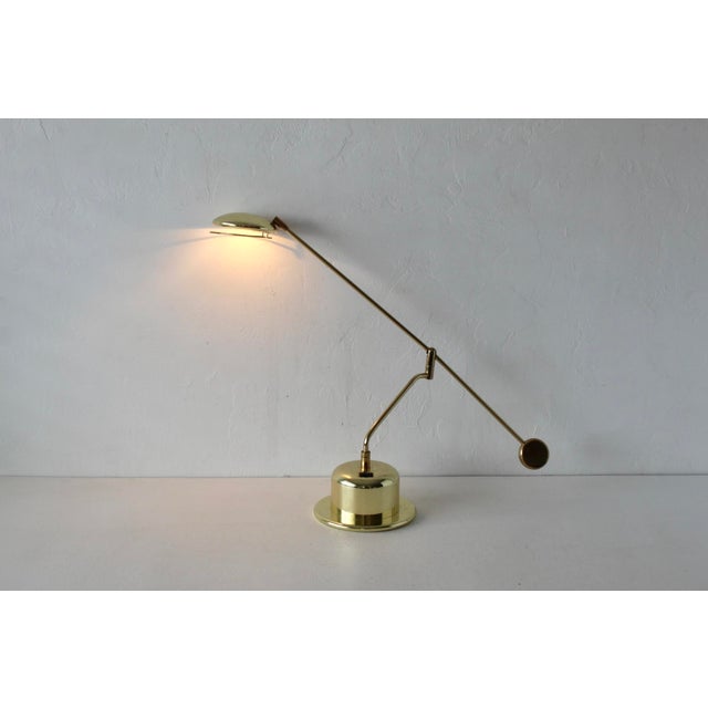 Modernist table lamp in the style of Bankamp Leuchten G from the 1980s. Made from solid brass and metal in a brass tone...