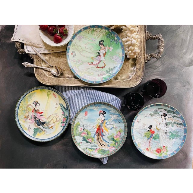 Set of four (4) Asian decorative plates, each depicting an Asian goddess. Soft colors of light blue, yellow, green and...