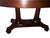 Elegant American Empire style mahogany center table or desk dating to the early 1900s, featuring a large oval top with...