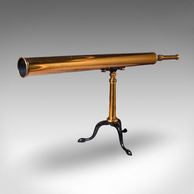 This is a vintage cased library telescope. An English, brass 'Starboy' astronomical mounted refractor by Broadhurst,...