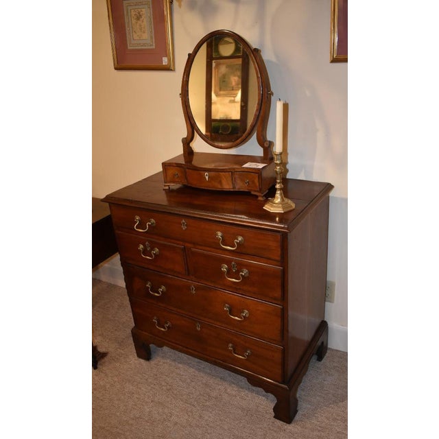 18th century English walnut "bachelors chest" in a great small size. A molded edge overhang top is above one long drawer,...