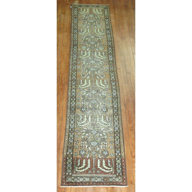 An early 20th Century Runner with an all-over tree of life design on abrown field. Professionally Cleaned and able to...