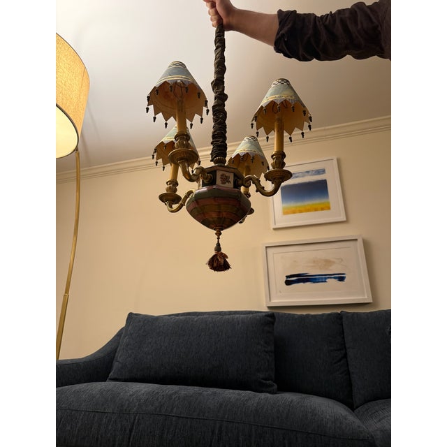 MacKenzie Childs Four Light Chandelier, in russet and toffee ceramic with scrolling brass arms and custom painted and...