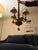 MacKenzie Childs Four Light Chandelier, in russet and toffee ceramic with scrolling brass arms and custom painted and...