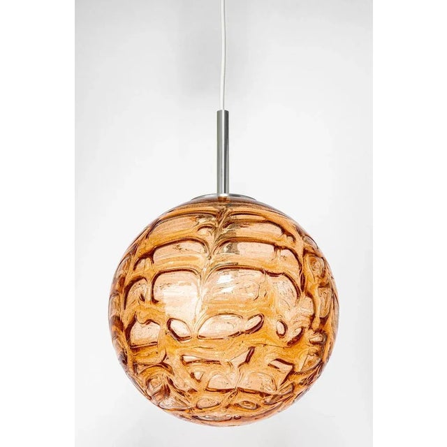 Doria ceiling light with large volcanic murano glass ball. High-quality materials, give a wonderful light effect when it...