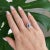 Vintage ring in 18 carat white gold (750 thousandths). It is decorated with diamonds surrounding a natural oval sapphire....