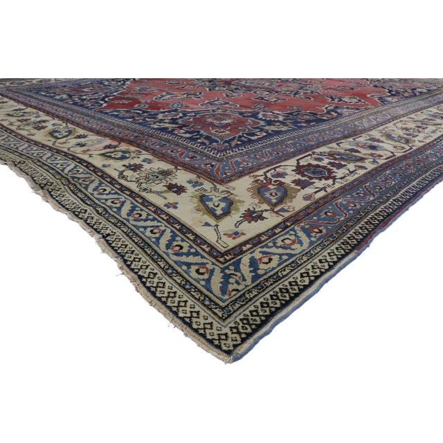 Distressed Antique Persian Mashhad Rug with Modern Rustic Style 13'00 x 16'05. This hand-knotted wool distressed antique...