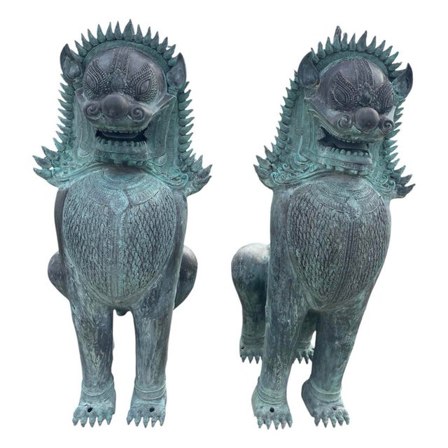 Command presence and architectural grandeur with this monumental pair of Southeast Asian guardian lion (Chinthe / Singha)...
