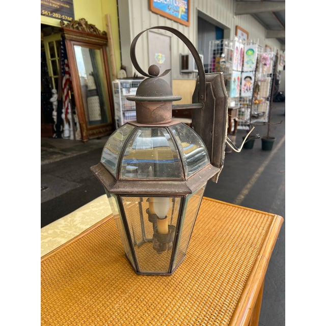 This vintage outdoor light fixture is crafted from copper and glass, showcasing a rich, authentic patina that adds...