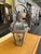 This vintage outdoor light fixture is crafted from copper and glass, showcasing a rich, authentic patina that adds...