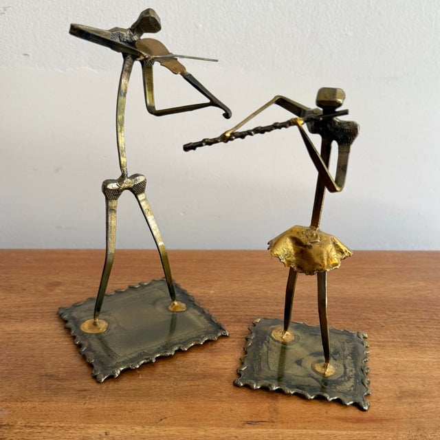 Jazzy metal pair of brutalist instrumentalists, playing a violin and a flute. Most items found at Pub & Oasis are vintage...