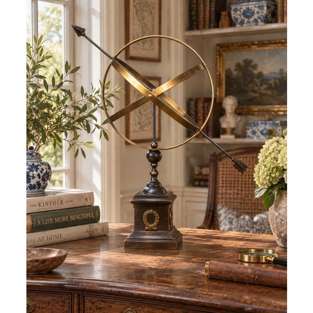 A beautifully crafted iron and brass armillary sphere, evoking the timeless elegance of classical European gardens. Pieces...