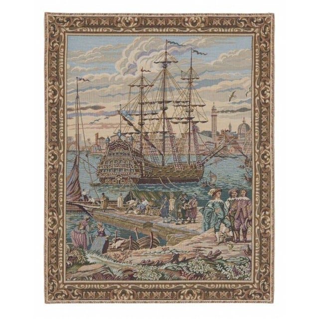 This tapestry represents a 17th Century scene of the ancient port of Venice in Italy. In a busy quayside scene, local...