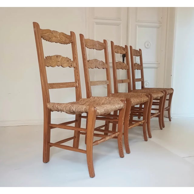 This beautiful set of four dining chairs are from the late 70s. They are built with pine wood, rush seats and some, light...