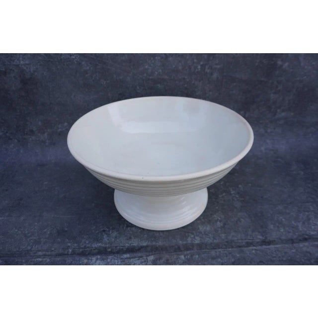 Measures 7 1/2" high x 14" diameter. Some minor repair. A classical elegance to the design makes this a timeless piece.