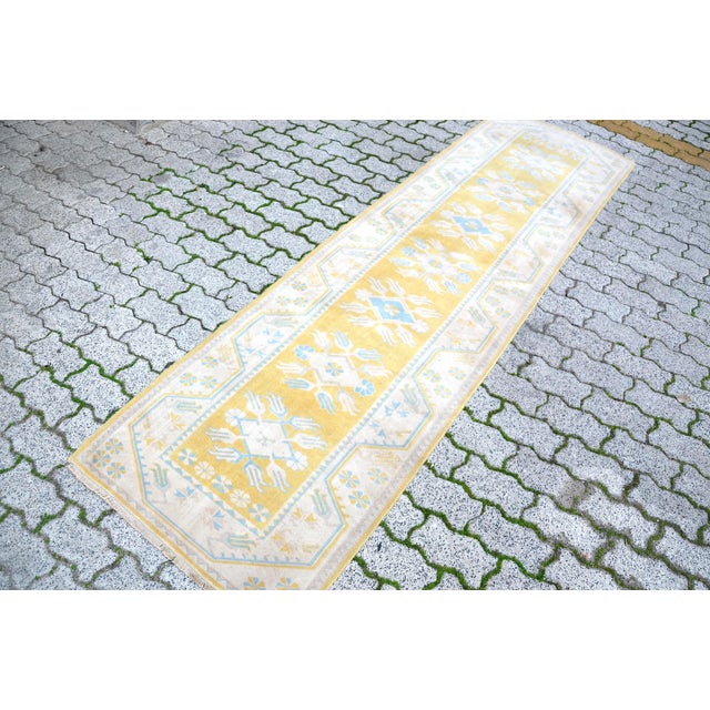 A Turkish handmade vintage Anatolian Oushak rug. We collect old vintage antique rugs from Anatolia, which is the eastern...