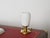 Delightful italian table lamp in brass and opaline glass. This lovely lamp was designed in italy during the 1950s. In...