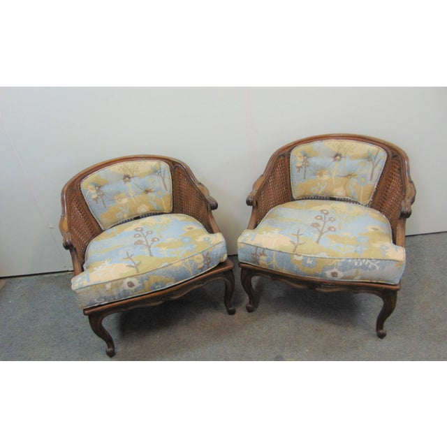 Louis XV Style Walnut Caned Armchairs, all around caned, back with attached tufted floral upholstery, floral upholstered...