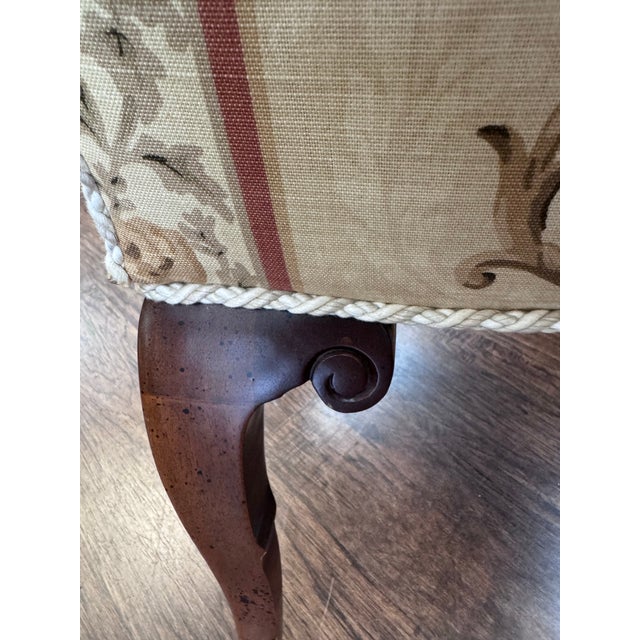 An elegant set of eight matching dining chairs featuring tall upholstered backs, graceful carved cabriole-style legs, and...