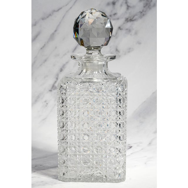 A dazzling example of turn-of-the-century glass craftsmanship, this circa 1900 crystal decanter has a substantial presence...