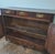 This elegant French carved oak buffet is a charming example of provincial craftsmanship. It features a beautifully aged...