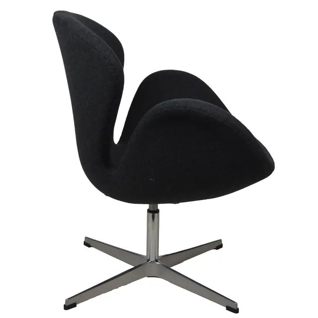 Modernist swan type chair. Early 21st C with charcoal flannel upholstery and a metal alloy star base. Great looking and...