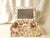 This fabric-covered jewelry box with mirror handcrafted by We've Got You Covered in Gardena, California, brings...