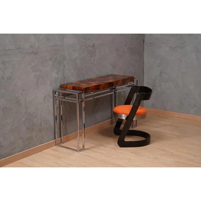 Refined and elegant console in chrome and wood, one of a kind design; chrome and wood design go perfectly together. This...