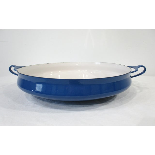 A wonderful Mid-Century oven or paella baking pan in blue and white enameled metal designed by Jens Quistgaard whose...