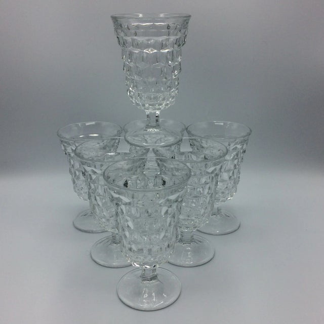 Beautiful set of 7 stemmed water goblets by Fostoria. The classic cubist design American pattern. Pressed glass made in USA.
