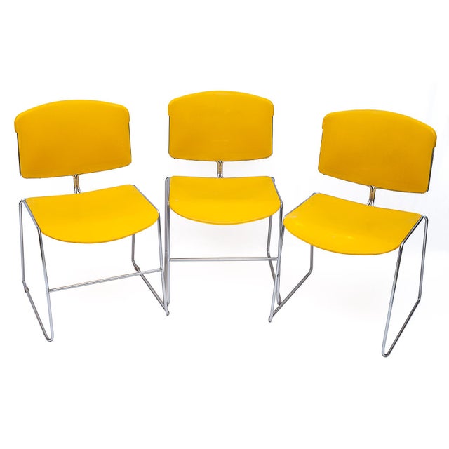 Set of 6 stackable chairs by Max Stacker for Steelcase Strafor. Saffron yellow. Chrome base. Seat height: 44 cm. Stackable...