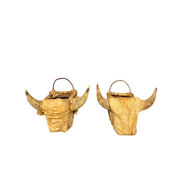 A fabulous pair of late 20th-century sculptural bull-head wall baskets with an unmistakable Southwestern and Rancho...