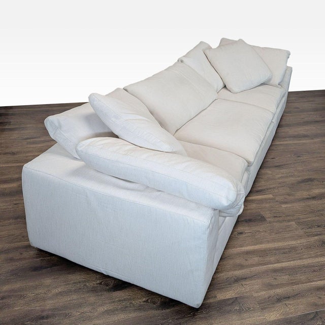 This Restoration Hardware 3-seat sofa offers spacious and comfortable seating with its plush cushions and soft white...