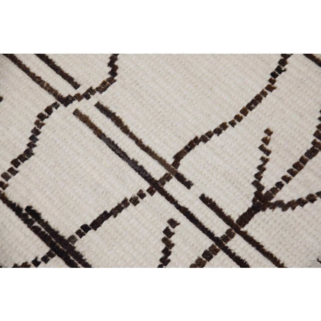 Introducing our exquisite handwoven wool modern Moroccan-style rug, a stunning blend of traditional craftsmanship and...