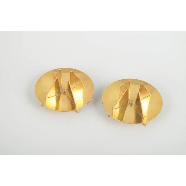Pierre Forssell for Skultuna Pair of brass candlesticks, 1960s. Elegant and sculptural design in solid brass with...