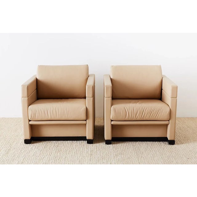 Sleek pair of leather cube chairs by Geiger International for Herman Miller. Iconic cube chair design made famous by...