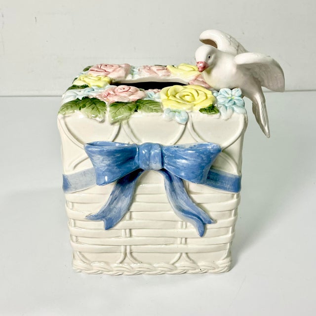 Of course this pretty ceramic Tissue Box Cover is from American ceramics company Fitz & Floyd. It features there...