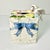 Of course this pretty ceramic Tissue Box Cover is from American ceramics company Fitz & Floyd. It features there...