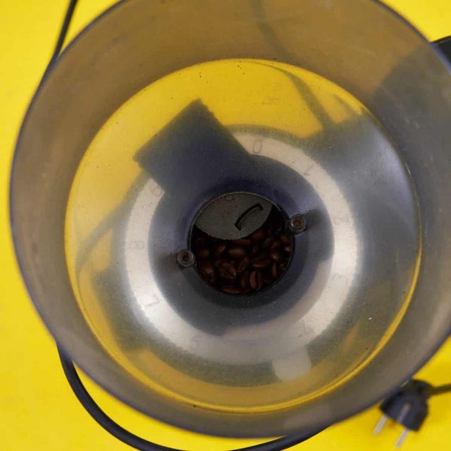 Discover this charming vintage coffee grinder, a perfect example of functional design from the 1970s. Crafted from...
